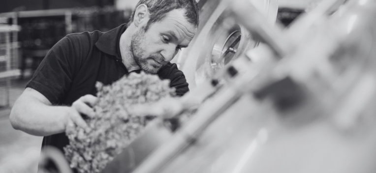 Moorhouse's Head Brewer Dan Casaru adding Hops during the brewing process.