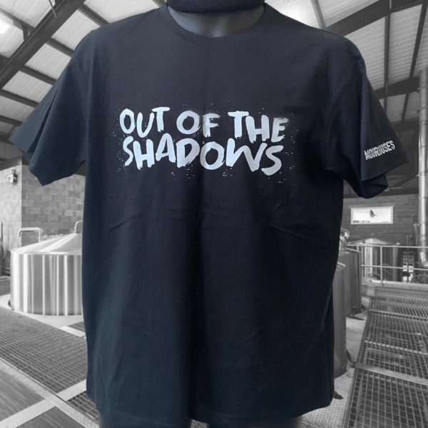 Black unisex short sleeve t-shirt with out of the shadows branding to chest and moorhouse's logo on sleeve cuff.